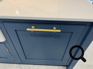 Brass handle wiyh dark blue inframe kitchen